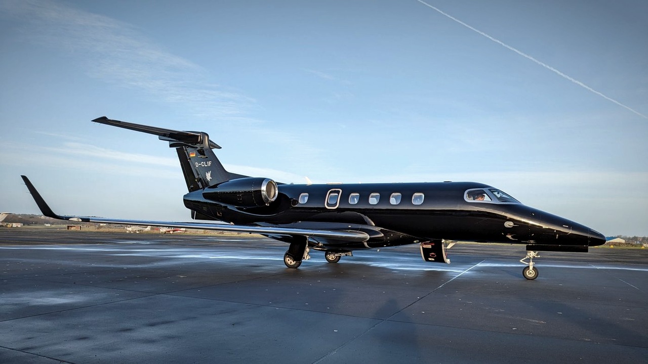 Black private jet full detail on tarmac