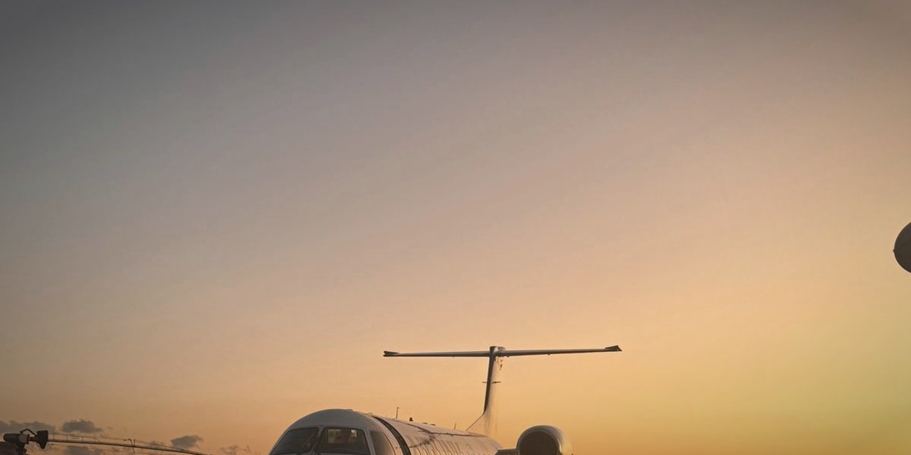 Private jet at golden sunset on the ramp